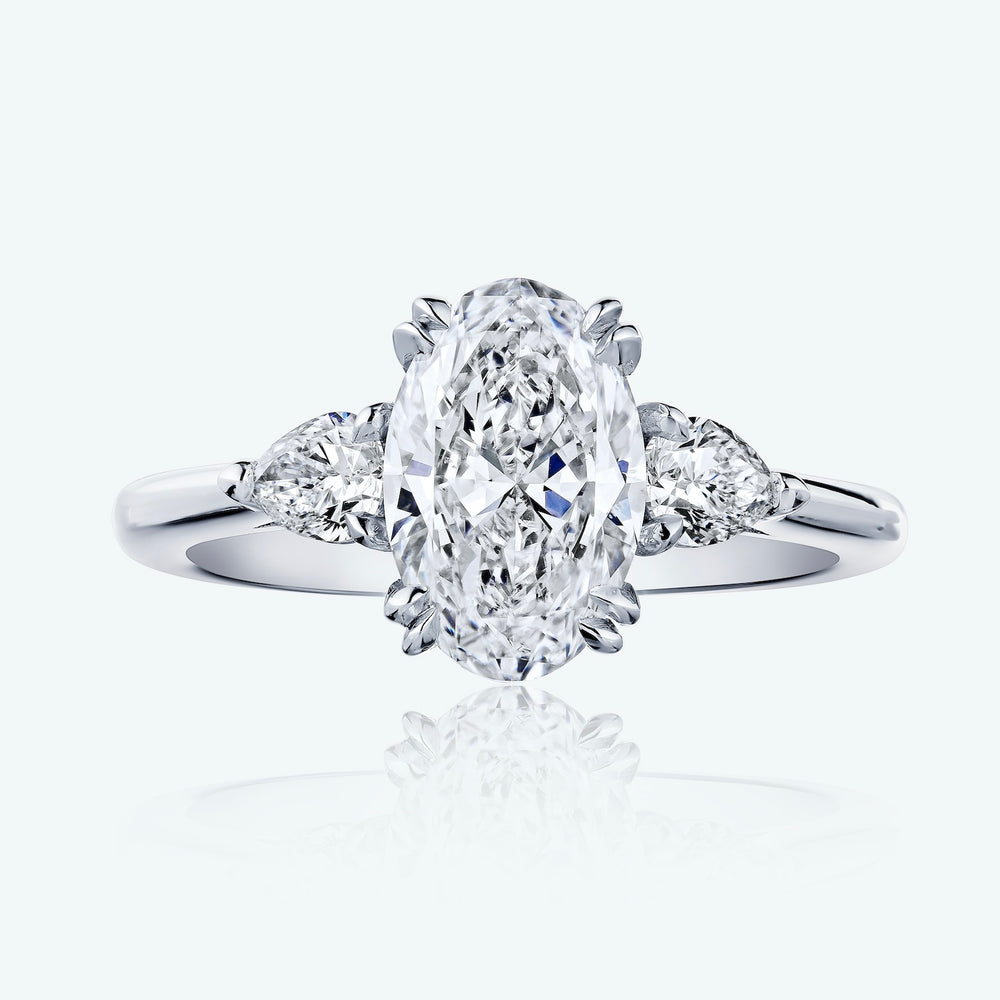 ENGAGEMENT RING WITH PEAR SIDE STONES